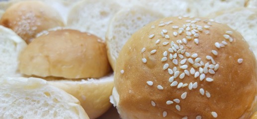 buns with sesame seeds,Soft bread, breakfast, tea and coffee, in the kitchen, mini cocktail, fresh bread, close up, bread shop