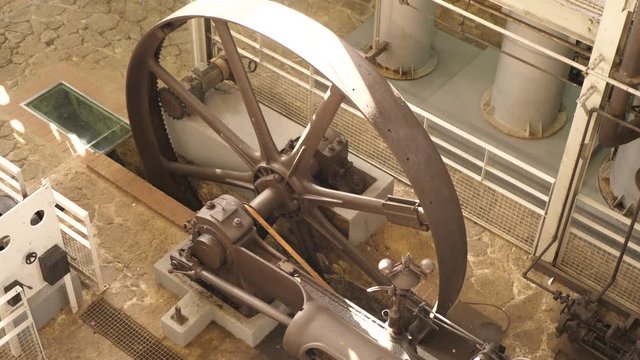 4K close up footage o wheel spinning in distillery called Habitation Clement on French Caribbean island Martinique.
