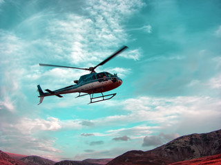 Plakat Helicopter color turquoise above the mountain
