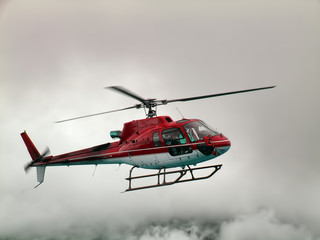Helicopter flying in the clouds