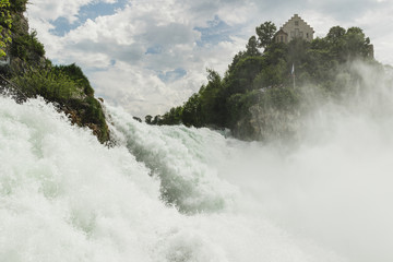 Nice landscape of the Rhine Falls, Switzerland. Massif impressive waterfall.