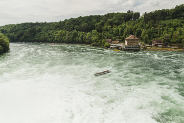 Nice landscape of the Rhine Falls, Switzerland. Massif impressive waterfall.