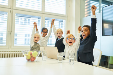 Multicultural children as a cheering start-up team