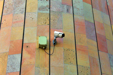 Security surveillance camera on wall
