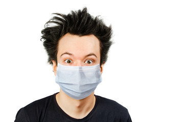 Unhappy, mad guy man wearing a protective face mask prevent virus infection or pollution on white isolated background