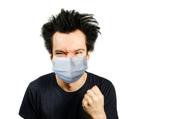 mad young man wearing a protective face mask prevent virus infection or pollution with fist on white isolated background