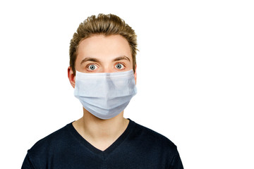 Unhappy, sad young guy wearing a protective face mask prevent virus infection or pollution on white isolated background