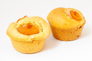 Juicy muffins on white background