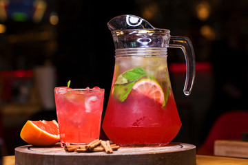 Restaurant dish - soft drink in a jug in dark