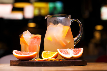 Restaurant dish - soft drink in a jug in dark