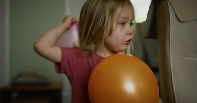 Little boy with balloons at home