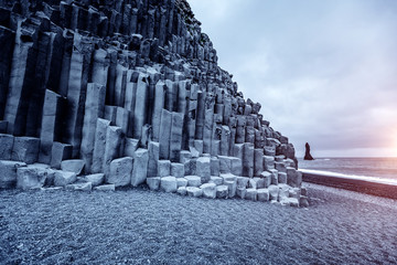 A unique rock on the Atlantic Ocean. Location Reynisfjara Beach, Iceland, Europe.