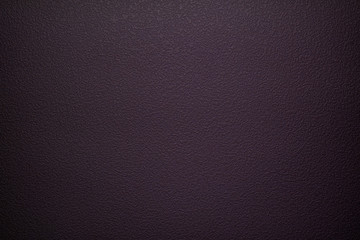 a dark background with uneven texture