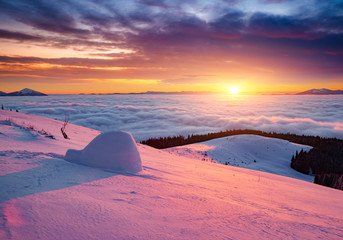 Fantastic air view of the valley covered with dense fog. Location Carpathian mountain, Ukraine, Europe.