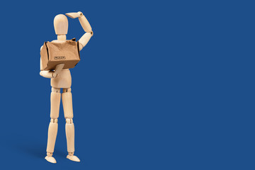 Toy man, delivery service worker with a cardboard box in his hands. The box is broken. Delivery service problem concept. Blue classic background
