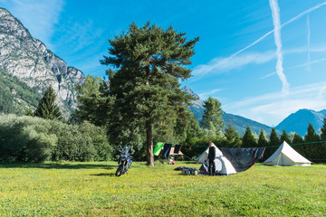 Biker doing camping in summer