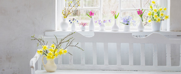 beautiful spring flowers in white vintage interior