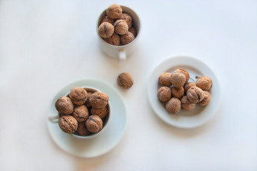 walnuts in a bowl isolated on white background