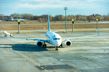Big beautiful plane after flight standing on airport runway