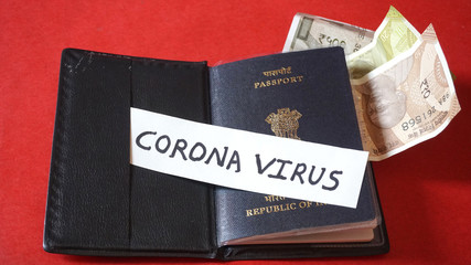 Coronavirus and travel concept. Note COVID-19 /coronavirus,  passport with sanitizer and handwash protection from corona virus.Travel restrictions and quarantine of tourists infected with Corona virus