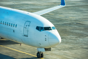 Big beautiful plane after flight standing on airport runway