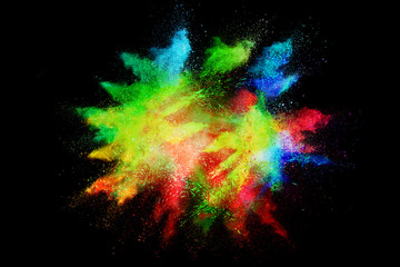 Celebrate festival Holi. Indian Holi festival of colours. Colorful powder explosion on black background.