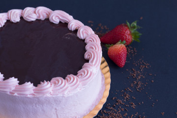 Full strawberry and chocolate cake cover with fresh strawberry