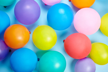 Fototapeta na wymiar Colorful balloons on blue background.