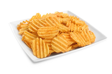 Plate with tasty potato chips on white background