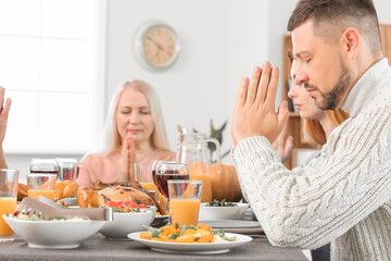 Family celebrating Thanksgiving Day at home