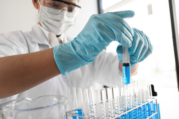 Female scientist are experimenting in the laboratory.