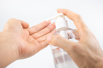 Man hands using wash hand sanitizer gel pump dispenser for protection corona virus and bacterias, health care concept.