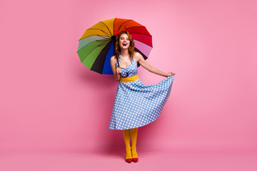 Full body photo of positive cheerful lady enjoy rain day forecast weather laughter touch polka-dot...