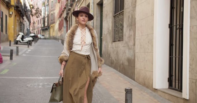 confident strong independent lady girl woman in retro walks the street happy smiling