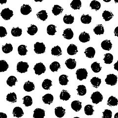 Seamless polka dot pattern hand drawn with a brush. Vector Monochrome Grunge texture of circles. Scandinavian background © Sini4ka