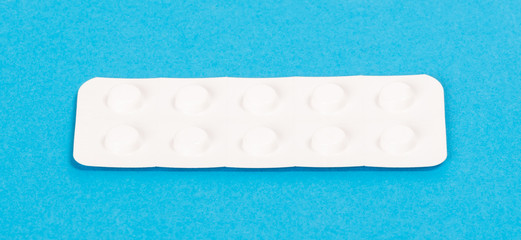 Pill strip on blue on background