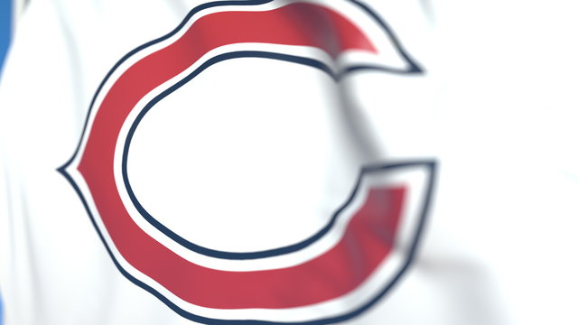 Waving flag with Chicago Bears team logo, close-up. Editorial 3D rendering
