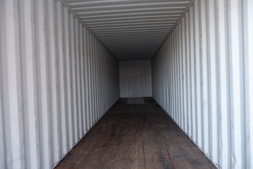 Inside empty dry high cube container with wooden floor