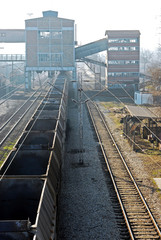 Fototapeta premium Freight train station. Composition of freight wagons. Rails at the train station. Loading point for the railway station.