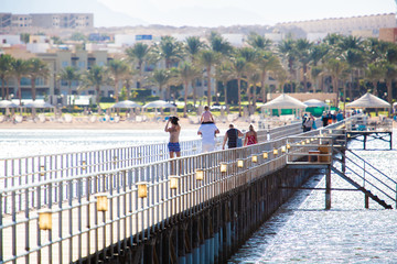 people walk on the pier. Red sea. vacation in egypt