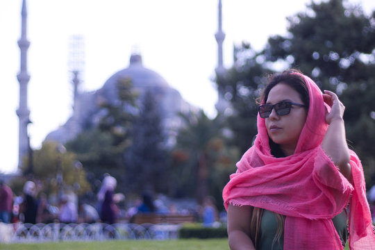  girl with pink burca and glasses