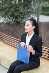 female staff holding a folder