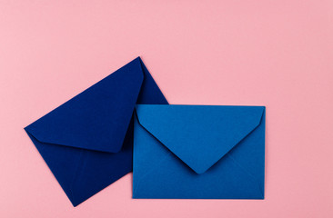 Blue envelopes on a pink background.