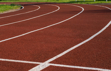 Running track in the stadium. Rubber coating. Treadmill in the fresh air. Healthy lifestyle concept. Athletes cardio workout