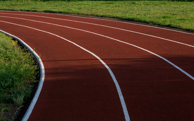 Running track in the stadium. Rubber coating. Treadmill in the fresh air. Healthy lifestyle concept. Athletes cardio workout
