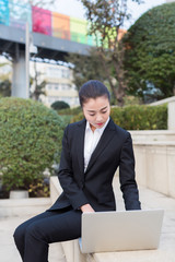 girl using a laptop computer