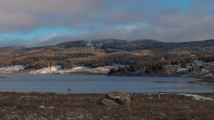 Beautiful autumn mountain lake and mountains