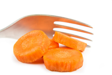 Slices of carrot with a fork. Diet concept