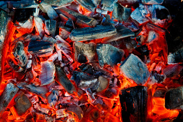 Orange flame of a fire. Bonfire on the grill with smoke.  Bonfire background.