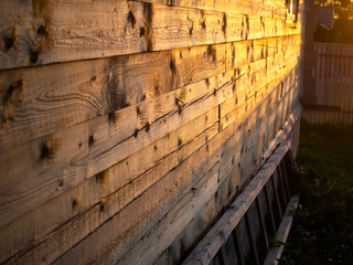 sunlight on the wall of a wooden house, Russia